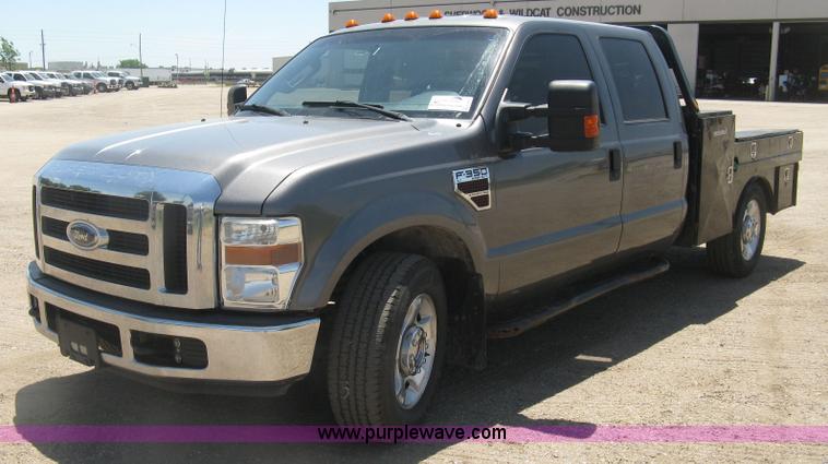 image for item K8652 2010 Ford F350 Super Duty XLT Crew Cab flatbed pickup truck