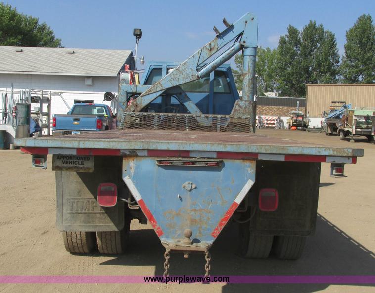 image for item A8854 1998 GMC C7500 flat bed truck with crane