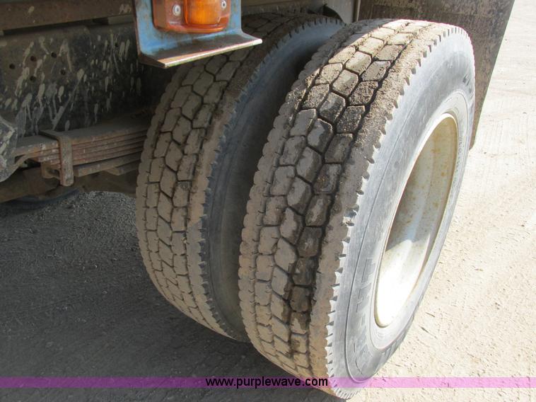 image for item A8854 1998 GMC C7500 flat bed truck with crane