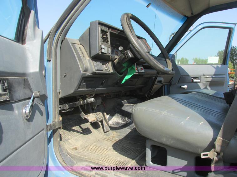 image for item A8854 1998 GMC C7500 flat bed truck with crane