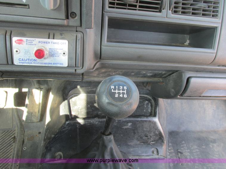 image for item A8854 1998 GMC C7500 flat bed truck with crane