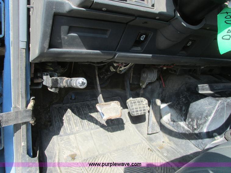 image for item A8854 1998 GMC C7500 flat bed truck with crane