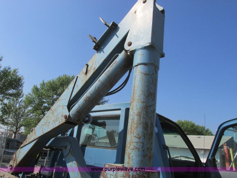 image for item A8854 1998 GMC C7500 flat bed truck with crane