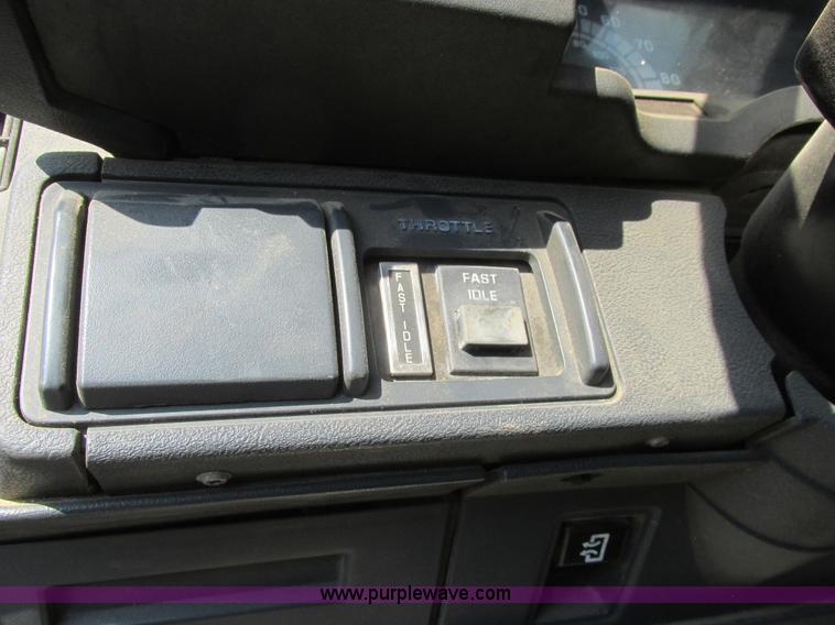 image for item A8854 1998 GMC C7500 flat bed truck with crane