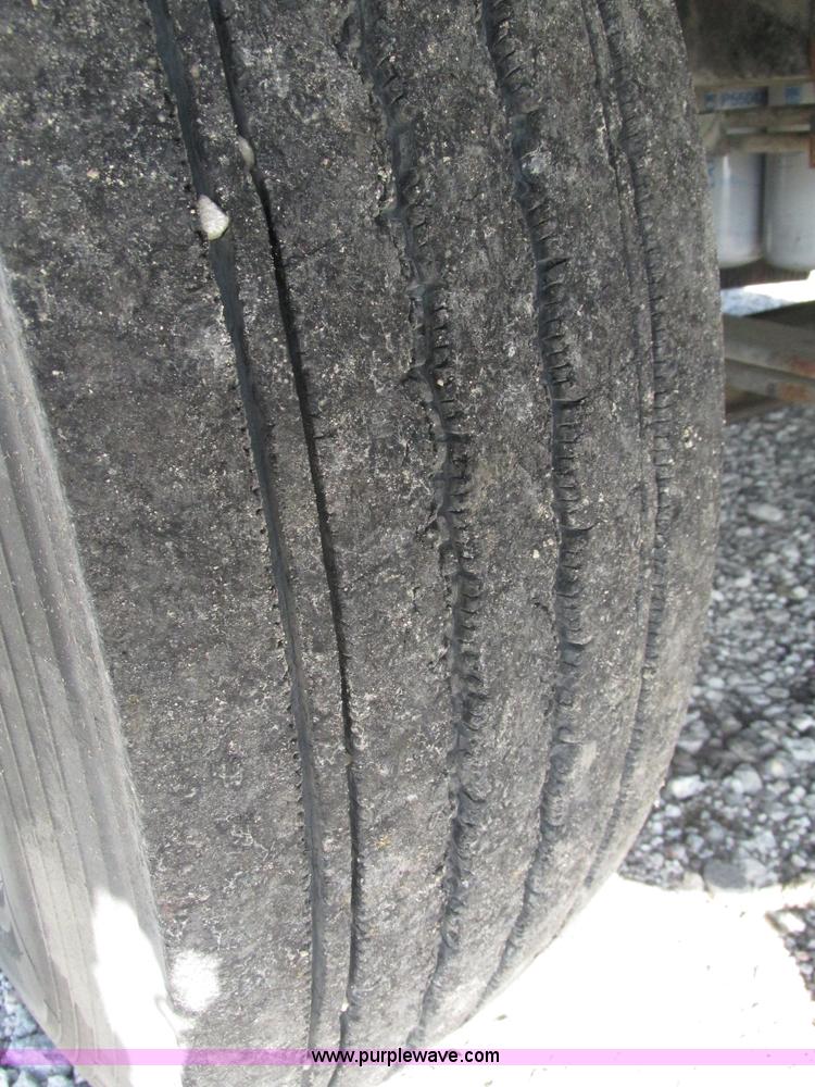 image for item H1179 2002 Volvo VNM water truck