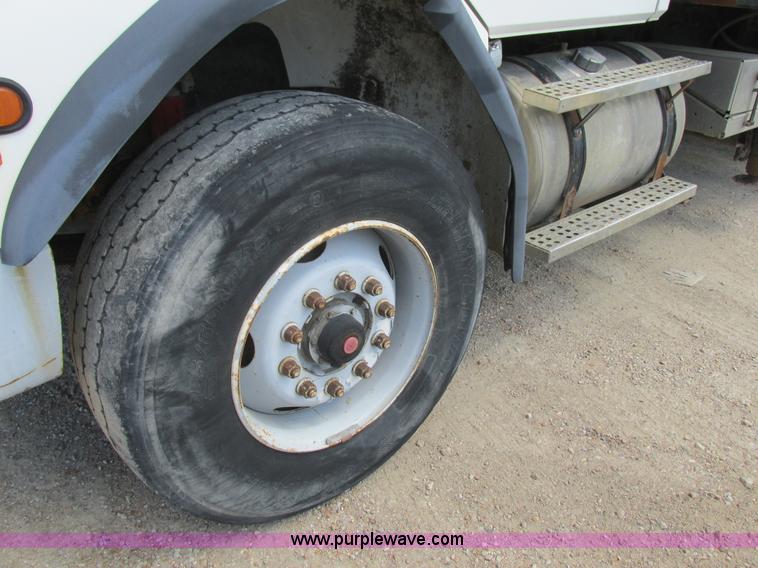 image for item K5108 1999 Freightliner FL112 flatbed truck with crane