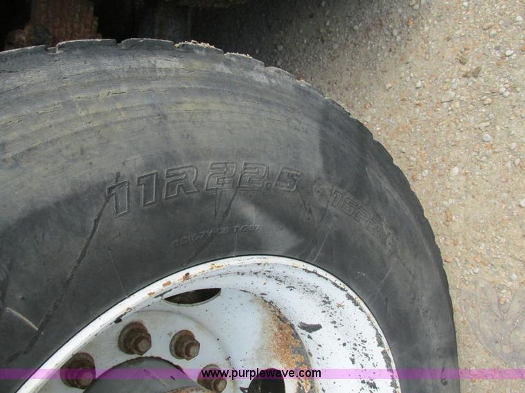 image for item K5108 1999 Freightliner FL112 flatbed truck with crane