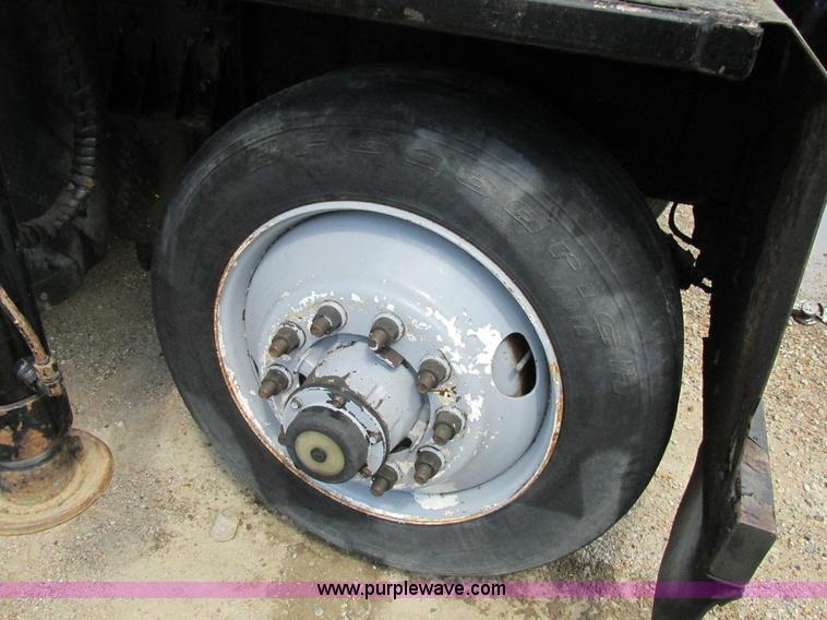 image for item K5108 1999 Freightliner FL112 flatbed truck with crane