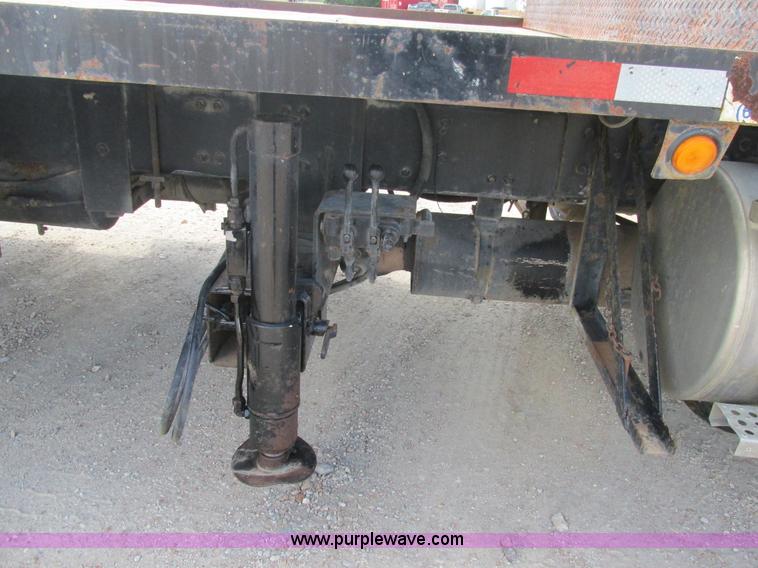 image for item K5108 1999 Freightliner FL112 flatbed truck with crane