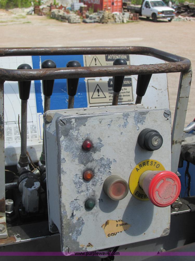 image for item K5108 1999 Freightliner FL112 flatbed truck with crane