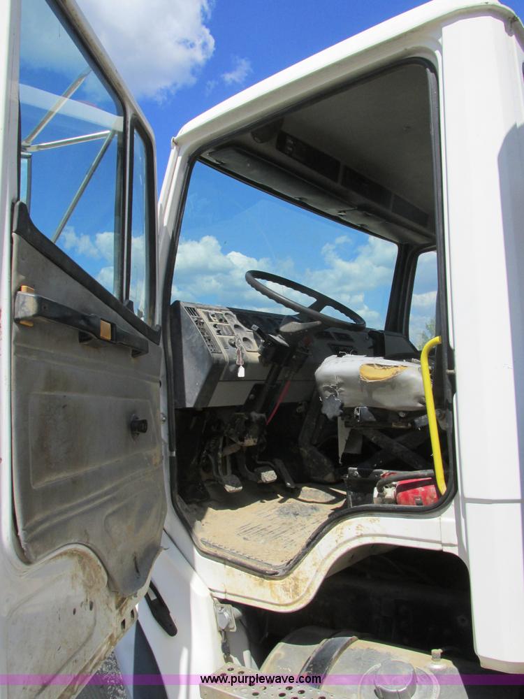 image for item K5108 1999 Freightliner FL112 flatbed truck with crane