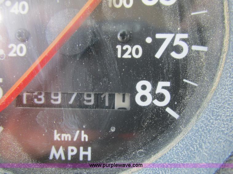 image for item K5108 1999 Freightliner FL112 flatbed truck with crane