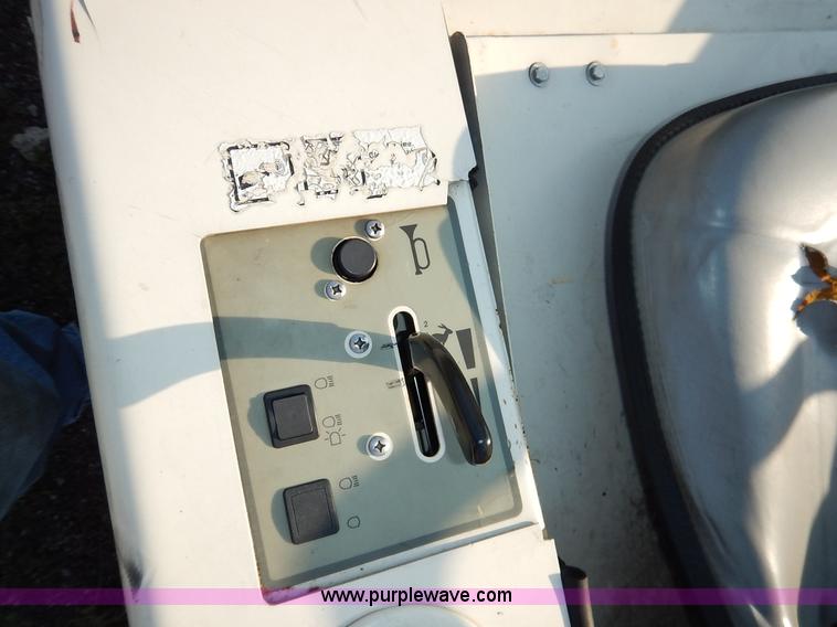 image for item L6250 2000 Tennant ATLV ride-on sweeper