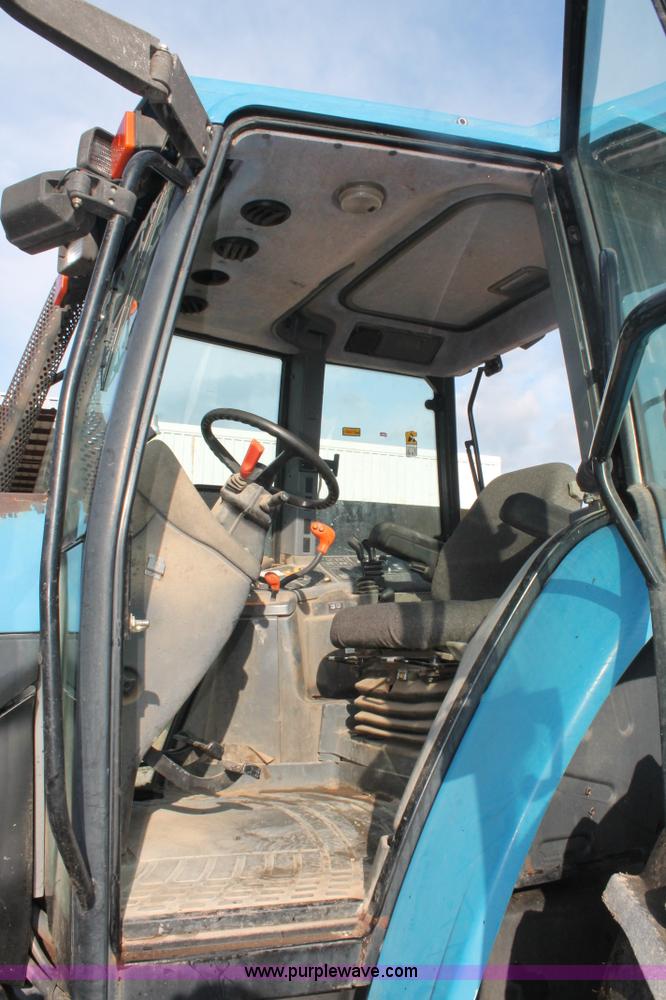 image for item H8121 1999 New Holland 8260 tractor