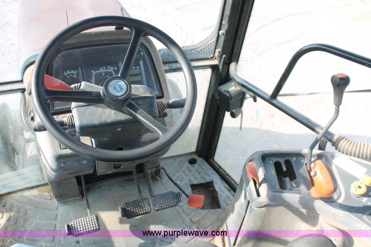 image for item H8121 1999 New Holland 8260 tractor