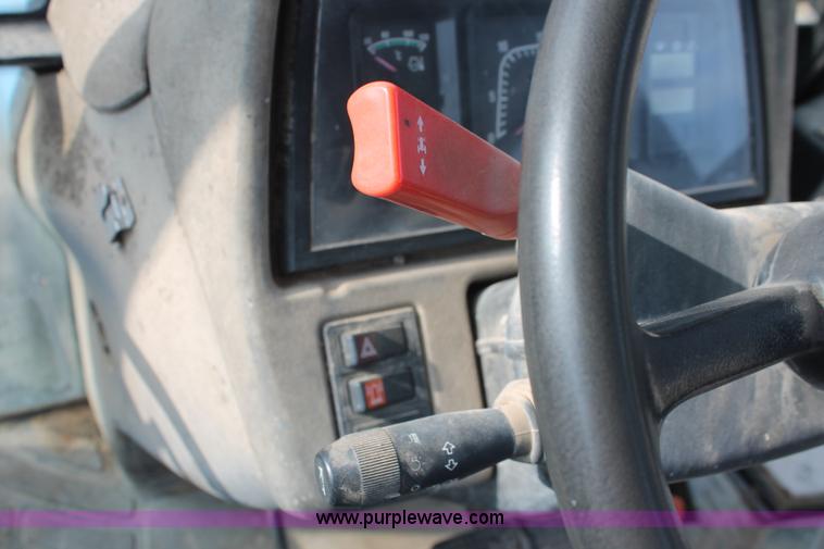 image for item H8121 1999 New Holland 8260 tractor