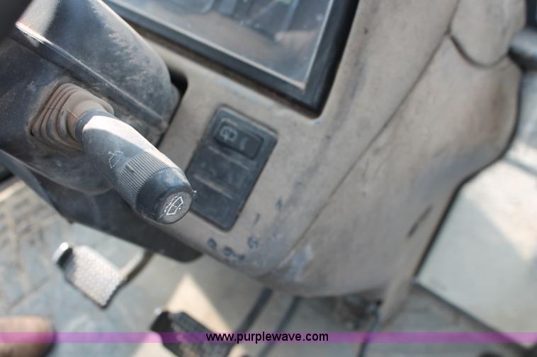 image for item H8121 1999 New Holland 8260 tractor