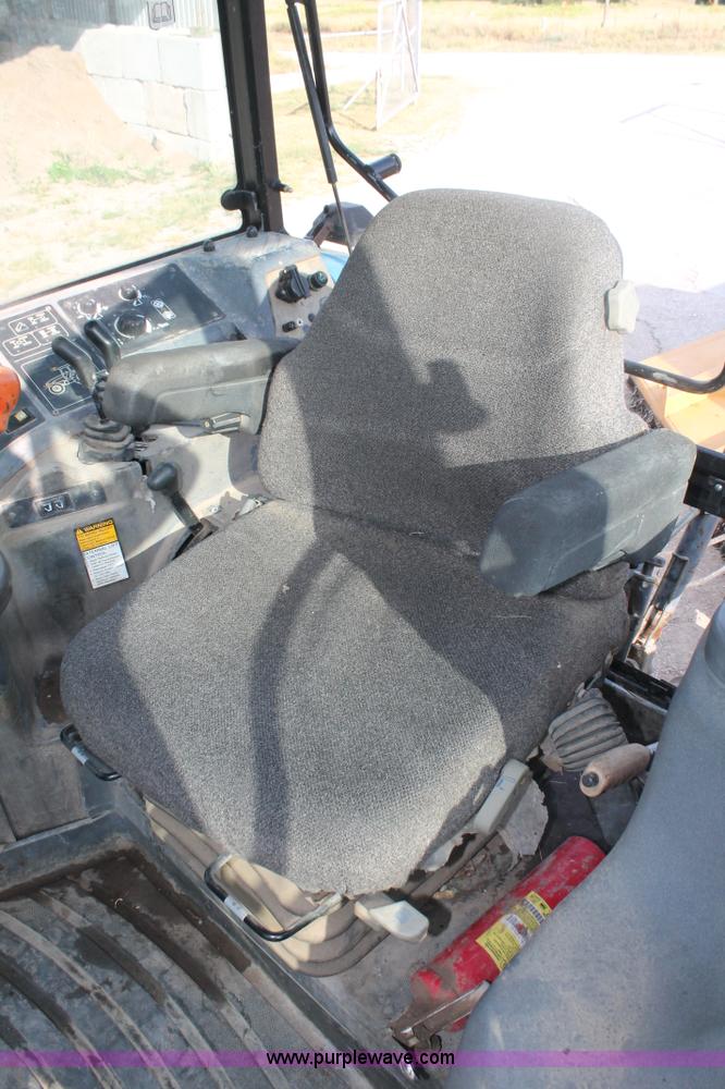 image for item H8121 1999 New Holland 8260 tractor