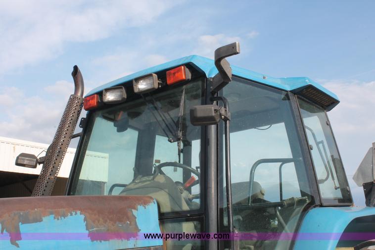 image for item H8121 1999 New Holland 8260 tractor