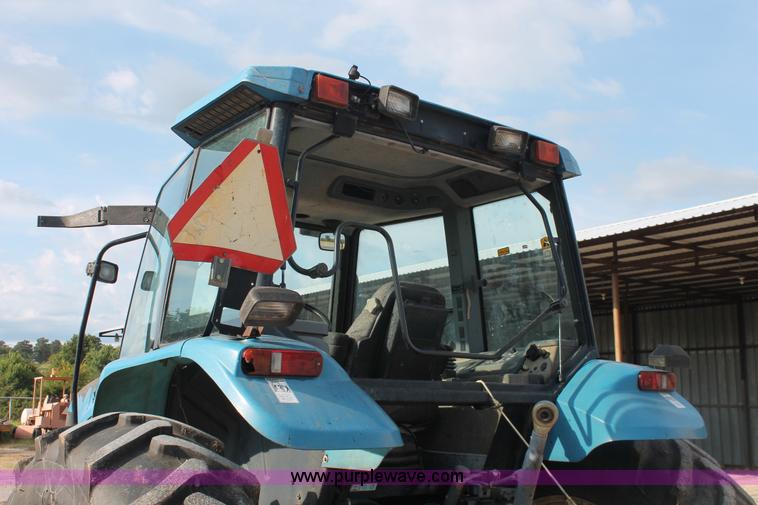 image for item H8121 1999 New Holland 8260 tractor