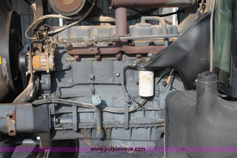 image for item H8121 1999 New Holland 8260 tractor