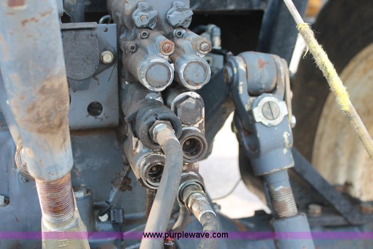 image for item H8121 1999 New Holland 8260 tractor