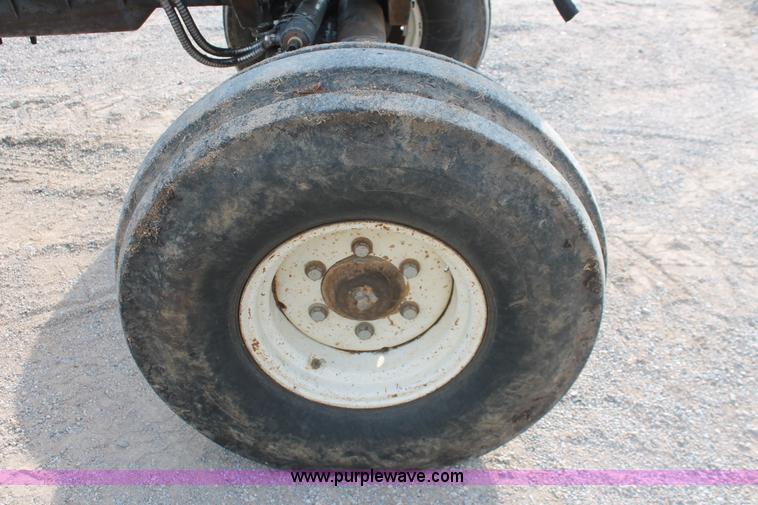 image for item H8121 1999 New Holland 8260 tractor