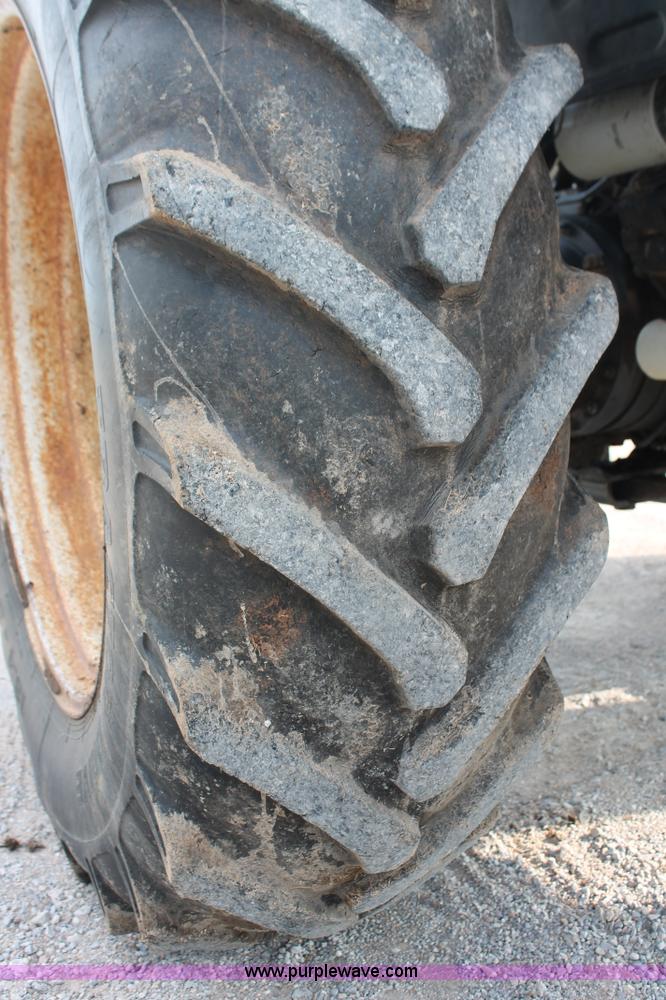 image for item H8121 1999 New Holland 8260 tractor