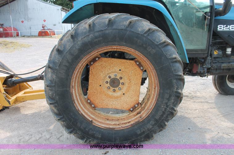 image for item H8121 1999 New Holland 8260 tractor