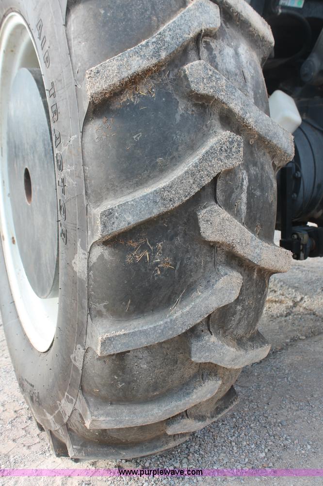 image for item H8121 1999 New Holland 8260 tractor