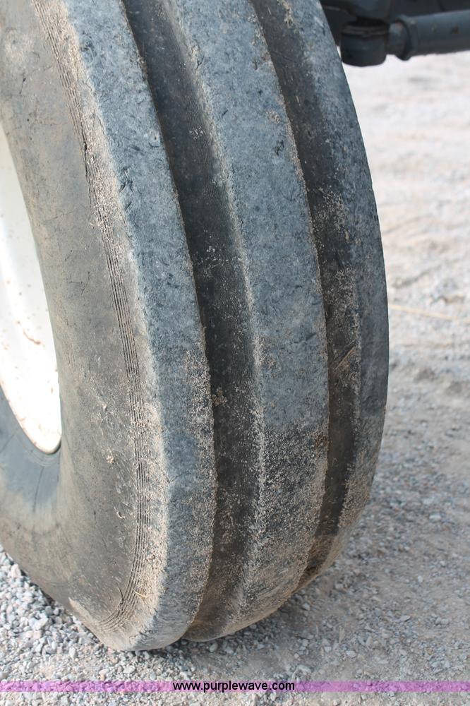 image for item H8121 1999 New Holland 8260 tractor