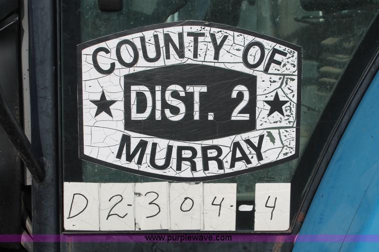 image for item H8121 1999 New Holland 8260 tractor