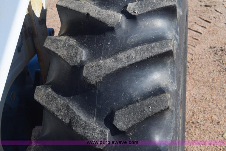 image for item J8122 New Holland 2120 tractor