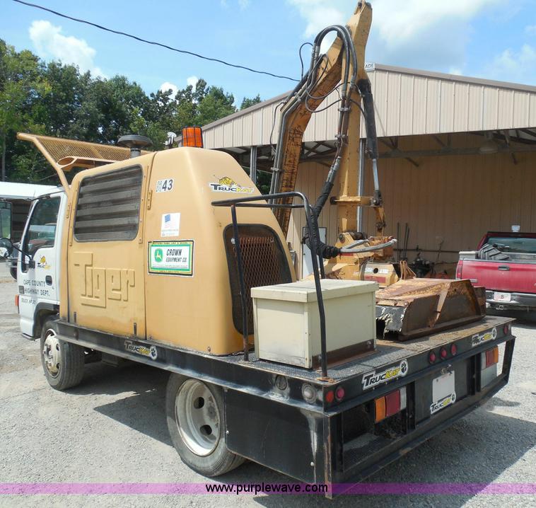 image for item K7527 2003 GMC W5500 flatbed truck with Tiger Truck Kat TRB-50C mower