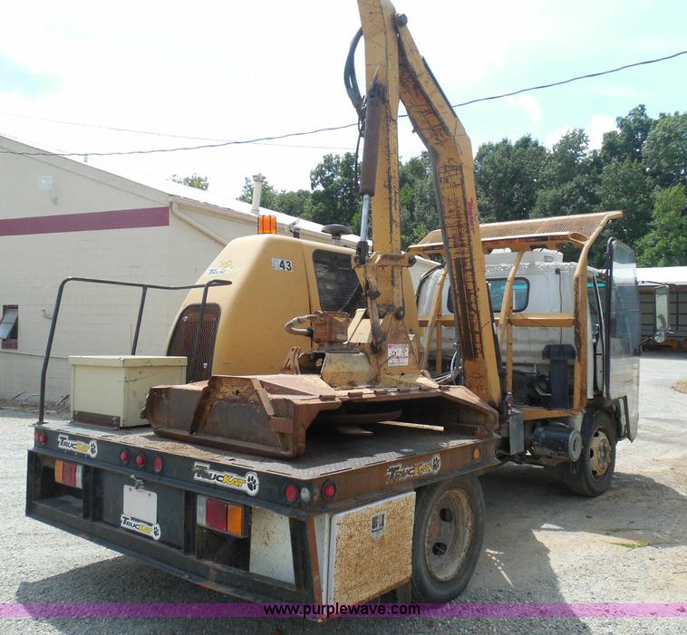 image for item K7527 2003 GMC W5500 flatbed truck with Tiger Truck Kat TRB-50C mower