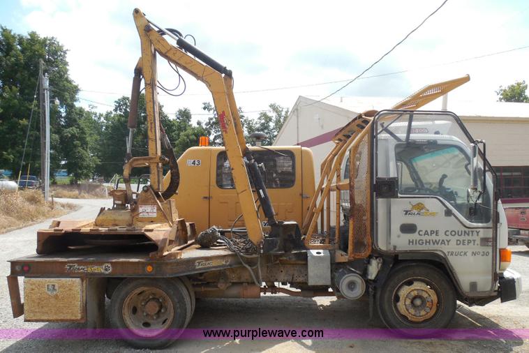 image for item K7527 2003 GMC W5500 flatbed truck with Tiger Truck Kat TRB-50C mower