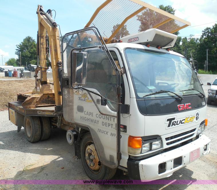 image for item K7527 2003 GMC W5500 flatbed truck with Tiger Truck Kat TRB-50C mower