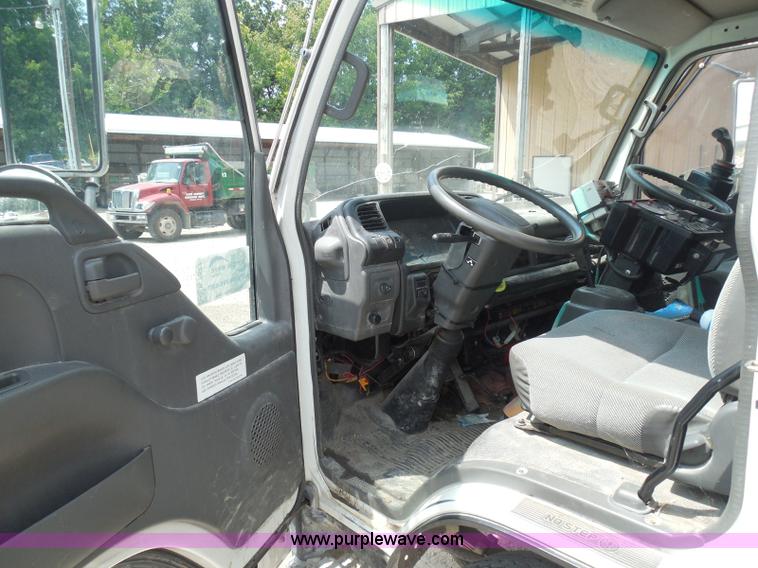 image for item K7527 2003 GMC W5500 flatbed truck with Tiger Truck Kat TRB-50C mower