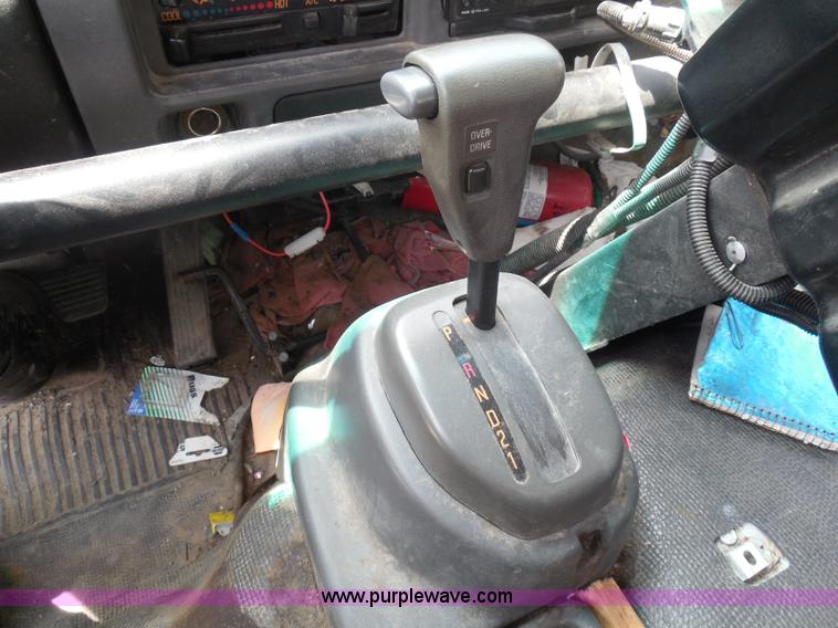 image for item K7527 2003 GMC W5500 flatbed truck with Tiger Truck Kat TRB-50C mower