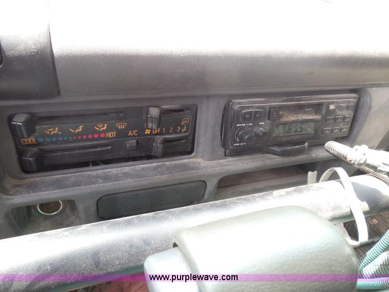 image for item K7527 2003 GMC W5500 flatbed truck with Tiger Truck Kat TRB-50C mower