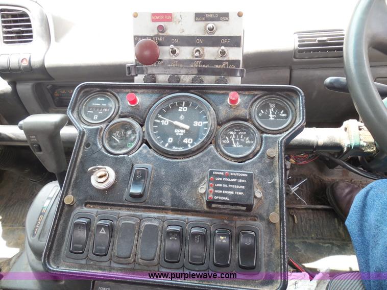 image for item K7527 2003 GMC W5500 flatbed truck with Tiger Truck Kat TRB-50C mower