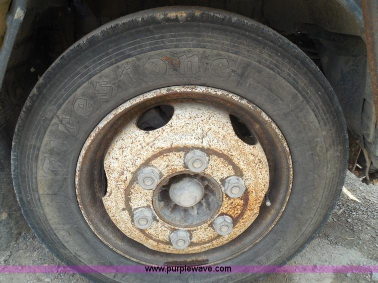 image for item K7527 2003 GMC W5500 flatbed truck with Tiger Truck Kat TRB-50C mower