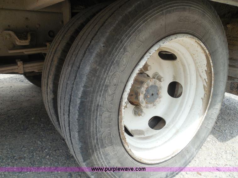 image for item K7527 2003 GMC W5500 flatbed truck with Tiger Truck Kat TRB-50C mower