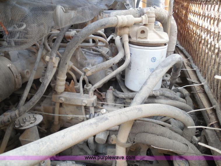 image for item K7527 2003 GMC W5500 flatbed truck with Tiger Truck Kat TRB-50C mower