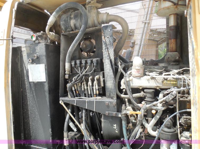 image for item K7527 2003 GMC W5500 flatbed truck with Tiger Truck Kat TRB-50C mower