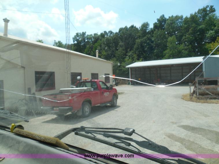 image for item K7527 2003 GMC W5500 flatbed truck with Tiger Truck Kat TRB-50C mower