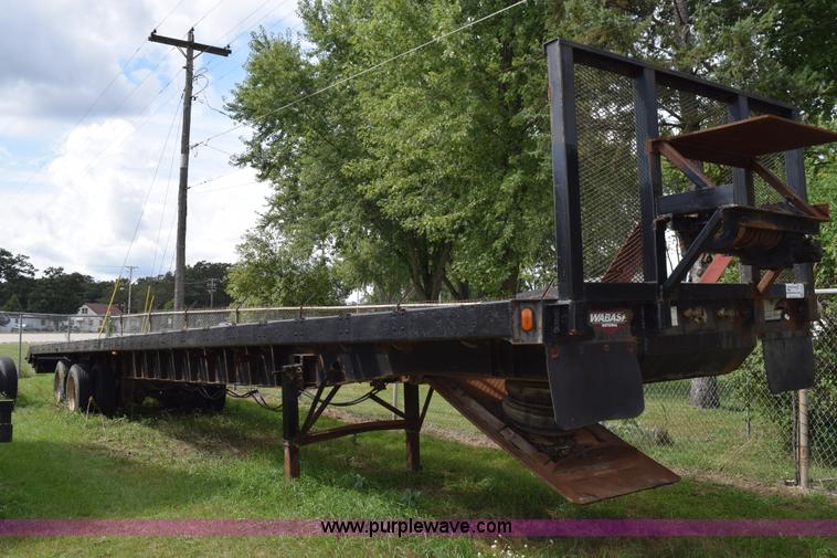 image for item K6642 1993 Wabash flatbed roller deck trailer