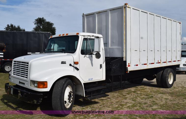 image for item K6657 1999 International 4700 dump bed chipper truck