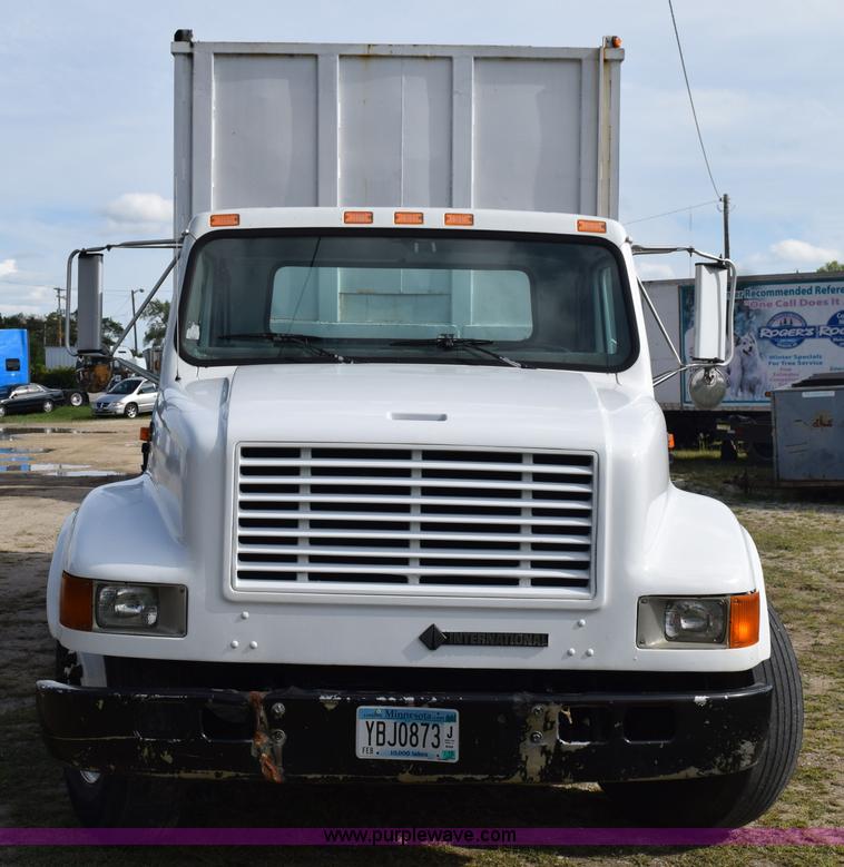 image for item K6657 1999 International 4700 dump bed chipper truck