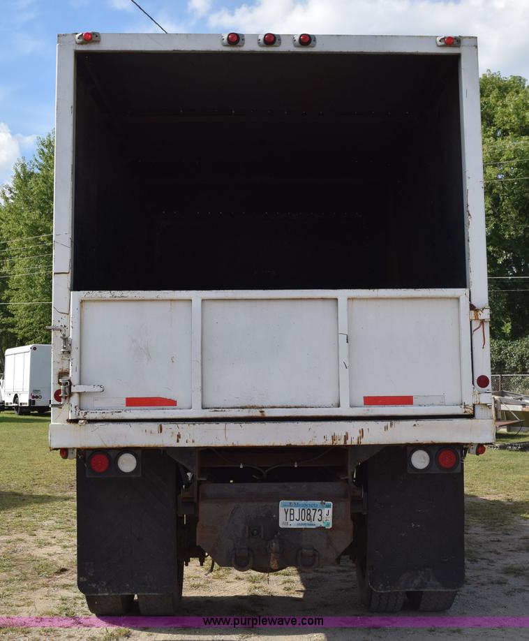 image for item K6657 1999 International 4700 dump bed chipper truck